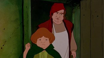 Movie still from “The Lord of the Rings” (1978), directed by Ralph Bakshi – A man standing next to a boy in a forest; Medium shot, High angle