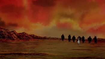 Movie still from “The Lord of the Rings” (1978), directed by Ralph Bakshi – A group of people riding horses across a field; Extreme Wide shot, Low angle