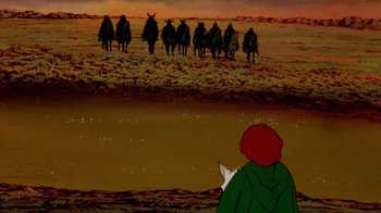 Movie still from “The Lord of the Rings” (1978), directed by Ralph Bakshi – A group of men riding horses across a field; Wide shot, High angle