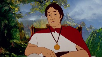 Movie still from “The Lord of the Rings” (1978), directed by Ralph Bakshi – An animated picture of a man with a medal around his neck; Medium shot, Low angle