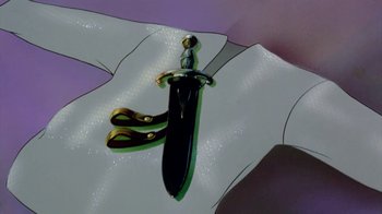 Movie still from “The Lord of the Rings” (1978), directed by Ralph Bakshi – A cartoon image of a knife and pair of scissor; Extreme Close Up shot, High angle