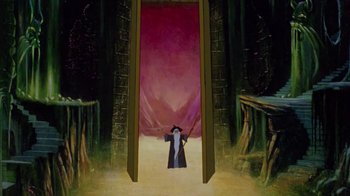 Movie still from “The Lord of the Rings” (1978), directed by Ralph Bakshi – A painting of a wizard standing in front of an open door; Wide shot, Low angle