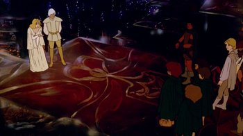 Movie still from “The Lord of the Rings” (1978), directed by Ralph Bakshi – A group of people standing on top of a rock; Wide shot, High angle