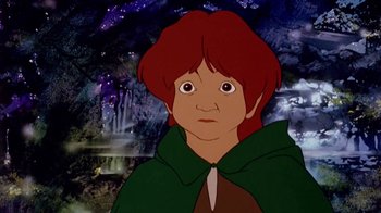 Movie still from “The Lord of the Rings” (1978), directed by Ralph Bakshi – A woman with red hair wearing a green cape; Close Up shot, High angle