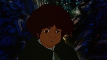 Movie still from “The Lord of the Rings” (1978), directed by Ralph Bakshi – A cartoon picture of a young boy with dark hair; Close Up shot, High angle