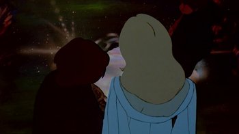 Movie still from “The Lord of the Rings” (1978), directed by Ralph Bakshi – Two people standing in front of a space background; Medium shot, Low angle
