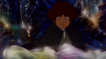 Movie still from “The Lord of the Rings” (1978), directed by Ralph Bakshi – A picture of a young boy in a black cape; Medium shot, High angle