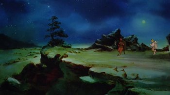 Movie still from “The Lord of the Rings” (1978), directed by Ralph Bakshi – A painting of a person standing in the snow; Extreme Wide shot, High angle
