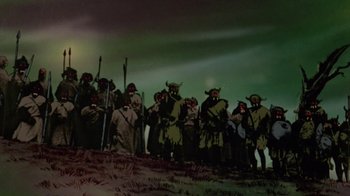 Movie still from “The Lord of the Rings” (1978), directed by Ralph Bakshi – A group of people dressed in costumes standing on top of a hill; Wide shot, Low angle