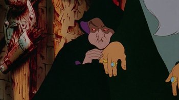 Movie still from “The Lord of the Rings” (1978), directed by Ralph Bakshi – A person holding an animal in their hand; Close Up shot, Over the shoulder angle