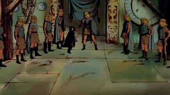 Movie still from “The Lord of the Rings” (1978), directed by Ralph Bakshi – A group of people standing around a building; Wide shot, High angle