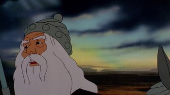 Movie still from “The Lord of the Rings” (1978), directed by Ralph Bakshi – An old man with long white hair wearing a green hat; Close Up shot, Low angle