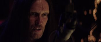 Movie still from “The Lords of Salem” (2012), directed by Rob Zombie – A person with long black hair; Close Up shot, Over the shoulder angle