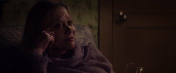 Movie still from “The Lords of Salem” (2012), directed by Rob Zombie – An older woman sitting in a chair covered in a blanket; Close Up shot, Over the shoulder angle