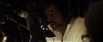 Movie still from “The Lords of Salem” (2012), directed by Rob Zombie – A man wearing headphones and a white shirt; Close Up shot, Low angle