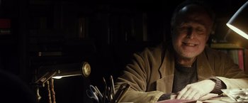 Movie still from “The Lords of Salem” (2012), directed by Rob Zombie – A person sitting in a chair with a bunch of scissors; Close Up shot, Low angle