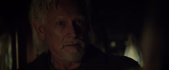 Movie still from “The Lords of Salem” (2012), directed by Rob Zombie – A person with a beard; Close Up shot, Over the shoulder angle