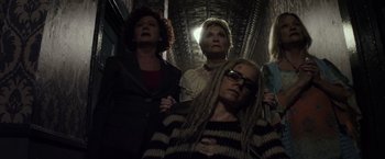 Movie still from “The Lords of Salem” (2012), directed by Rob Zombie – A group of women standing next to each other in a room; Medium shot, Overhead angle