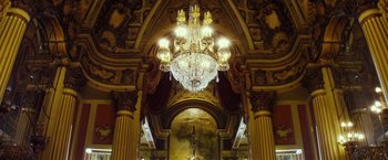 Movie still from “The Lords of Salem” (2012), directed by Rob Zombie – A chandelier hanging from the side of a wall; Extreme Wide shot, Low angle