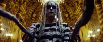 Movie still from “The Lords of Salem” (2012), directed by Rob Zombie – A man with dreadlocks and a skull face paint; Close Up shot, Low angle
