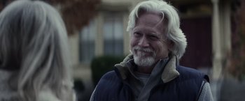 Movie still from “The Lords of Salem” (2012), directed by Rob Zombie – An older man with white hair and a gray beard; Close Up shot, Over the shoulder angle