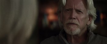 Movie still from “The Lords of Salem” (2012), directed by Rob Zombie – An older man with white hair and a gray beard; Close Up shot, Over the shoulder angle