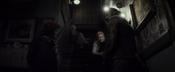 Movie still from “The Lords of Salem” (2012), directed by Rob Zombie – A group of people standing on a set of stairs; Wide shot, High angle