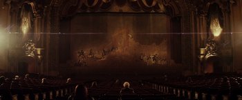 Movie still from “The Lords of Salem” (2012), directed by Rob Zombie – People are sitting in a theater watching a performance; Extreme Wide shot, High angle