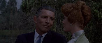 Movie still from “The Lost World” (1960), directed by Irwin Allen – A man and a woman are talking to each other; Close Up shot, Over the shoulder angle