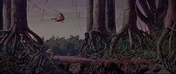 Movie still from “The Lost World” (1960), directed by Irwin Allen – A helicopter flying over a tree in a forest; Extreme Wide shot, High angle