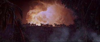 Movie still from “The Lost World” (1960), directed by Irwin Allen – A group of animals standing on top of a hill; Extreme Wide shot, High angle