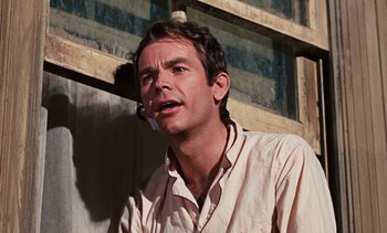 Movie still from “The Love Bug” (1969), directed by Robert Stevenson – A person wearing a white shirt; Close Up shot, Low angle
