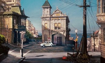 Movie still from “The Love Bug” (1969), directed by Robert Stevenson – A painting of an old fire station with a car parked in front of it; Extreme Wide shot, High angle