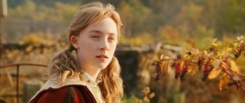 Movie still from “The Lovely Bones” (2009), directed by Peter Jackson – A young woman with long blonde hair and a white shirt; Close Up shot, Over the shoulder angle