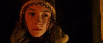 Movie still from “The Lovely Bones” (2009), directed by Peter Jackson – A person wearing a hat; Close Up shot, High angle