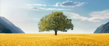 Movie still from “The Lovely Bones” (2009), directed by Peter Jackson – A tree in the middle of a field of wheat; Extreme Wide shot, Low angle