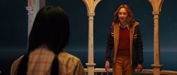 Movie still from “The Lovely Bones” (2009), directed by Peter Jackson – A woman standing in front of another woman in front of a building; Medium shot, Over the shoulder angle