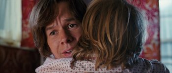 Movie still from “The Lovely Bones” (2009), directed by Peter Jackson – A person with a child; Close Up shot, Over the shoulder angle