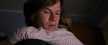 Movie still from “The Lovely Bones” (2009), directed by Peter Jackson – A woman with a blanket wrapped around her neck; Close Up shot, Over the shoulder angle