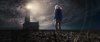 Movie still from “The Lovely Bones” (2009), directed by Peter Jackson – A woman standing in the middle of a field; Wide shot, Low angle