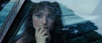 Movie still from “The Lovely Bones” (2009), directed by Peter Jackson – A woman sitting in a car looking out the window; Close Up shot, Over the shoulder angle
