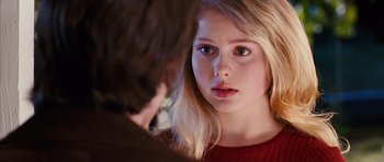 Movie still from “The Lovely Bones” (2009), directed by Peter Jackson – A young woman looking at a young man in front of a mirror; Close Up shot, Over the shoulder angle