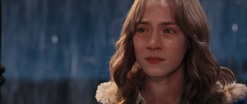 Movie still from “The Lovely Bones” (2009), directed by Peter Jackson – A young girl's face with tears in her eyes; Close Up shot, Over the shoulder angle
