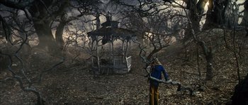 Movie still from “The Lovely Bones” (2009), directed by Peter Jackson – A man standing in front of an abandoned gazebo; Extreme Wide shot, High angle
