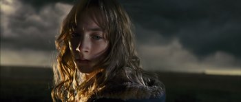 Movie still from “The Lovely Bones” (2009), directed by Peter Jackson – A woman with wet hair is standing in the dark; Close Up shot, Low angle