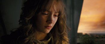 Movie still from “The Lovely Bones” (2009), directed by Peter Jackson – A person with long brown hair; Close Up shot, High angle