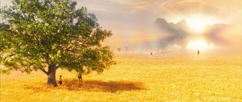 Movie still from “The Lovely Bones” (2009), directed by Peter Jackson – A tree in the middle of a field with people in the background; Extreme Wide shot, High angle