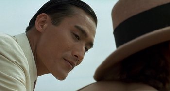 Movie still from “The Lover” (1992), directed by Jean-Jacques Annaud – A person looking at a person's face; Close Up shot, Over the shoulder angle