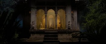 Movie still from “The Lovers” (2015), directed by Roland Joffé – Two people are sitting on a balcony in the dark; Extreme Wide shot, Low angle