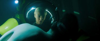 Movie still from “The Lovers” (2015), directed by Roland Joffé – A woman looking into a mirror in a dark room; Close Up shot, Over the shoulder angle